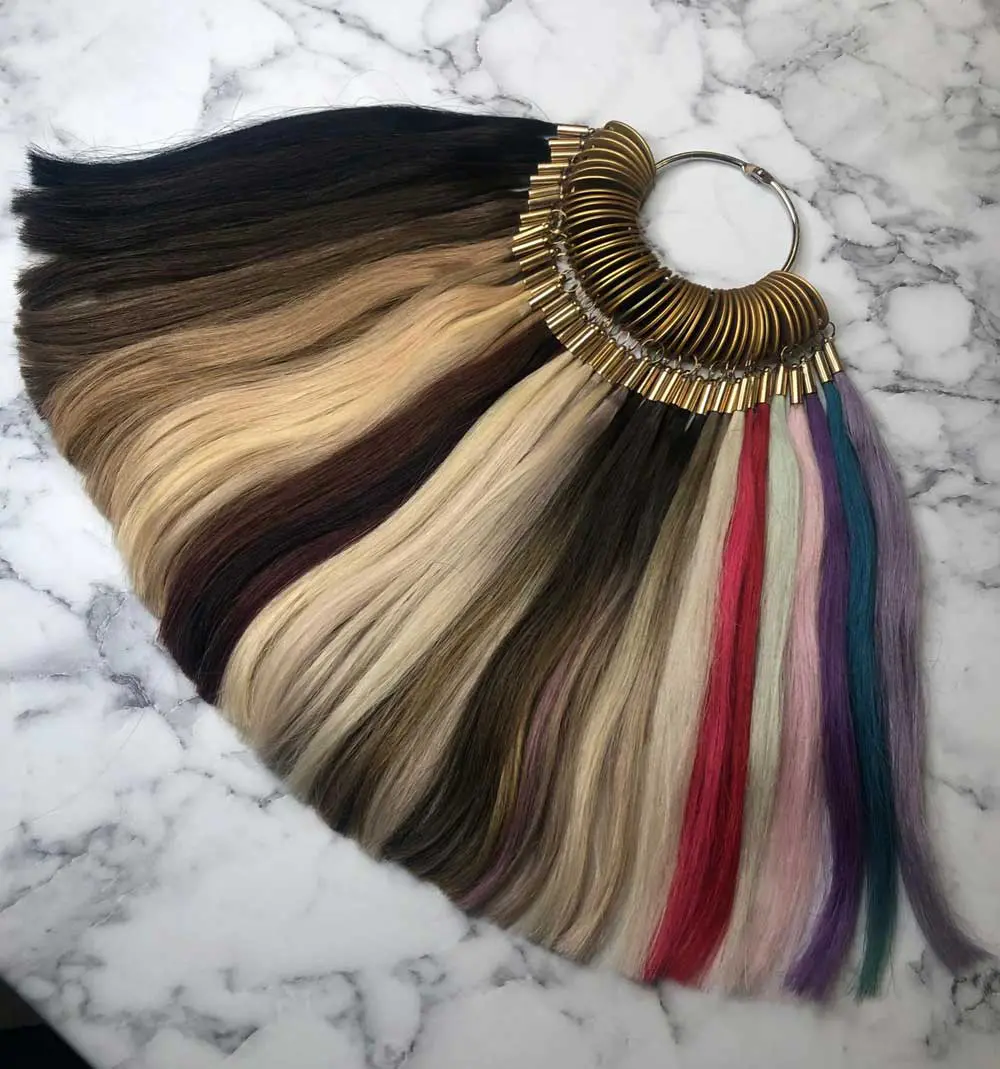 An image of different swatches of hair extensions on a metal ring